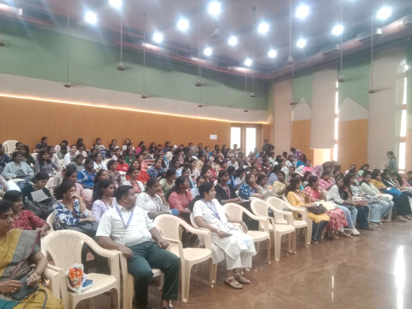 Students seated through the auditorium at Women's Christian College